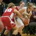 Dexter's Riley McDonald fights for the ball against Canton's Rachel Winters during the second half the regional semifinal game at Novi High School Tuesday, Mar. 5th.
Courtney Sacco I AnnArbor.com  